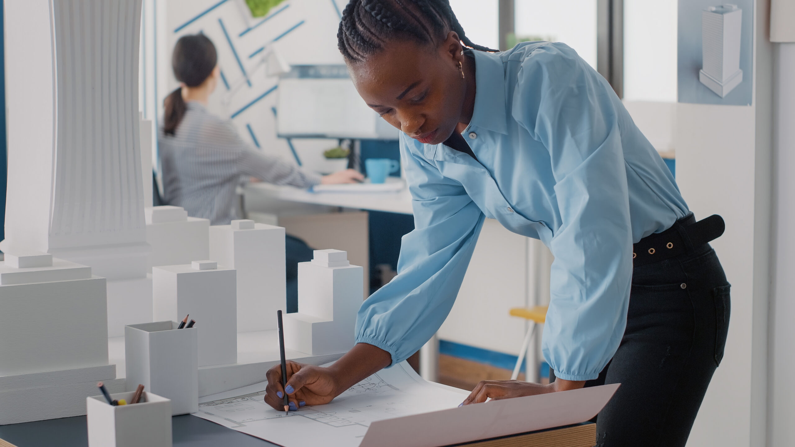 Women working on plans