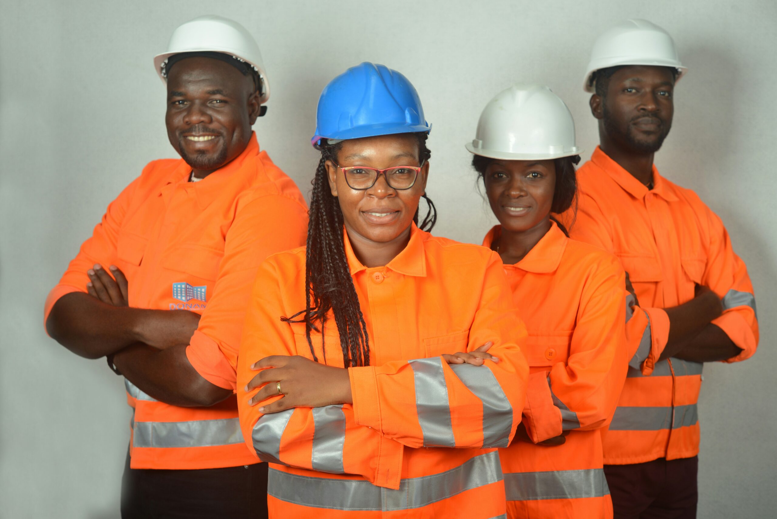 2 guys and two women dressed in construction gear