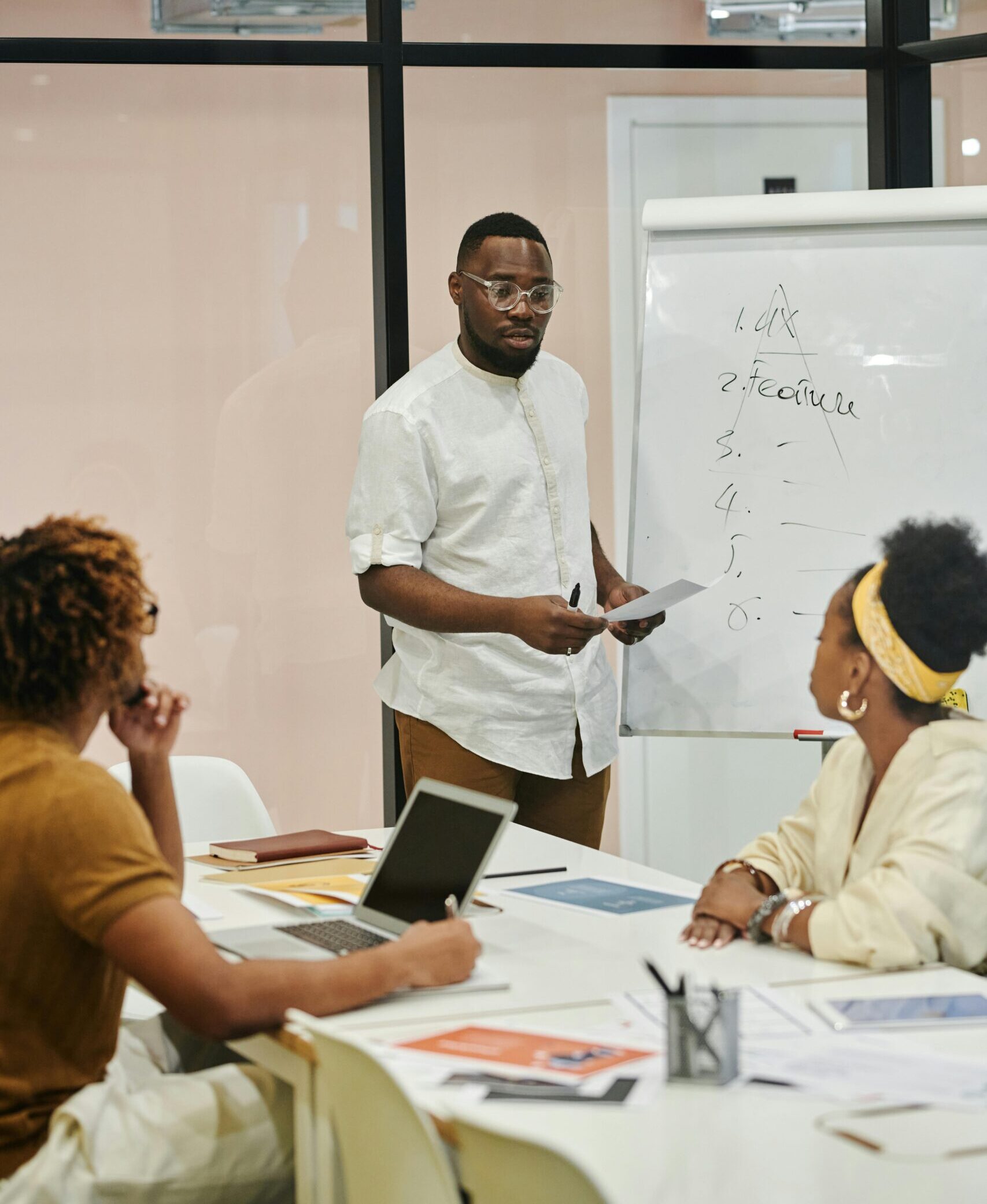 Black guy and two black women having a meeting