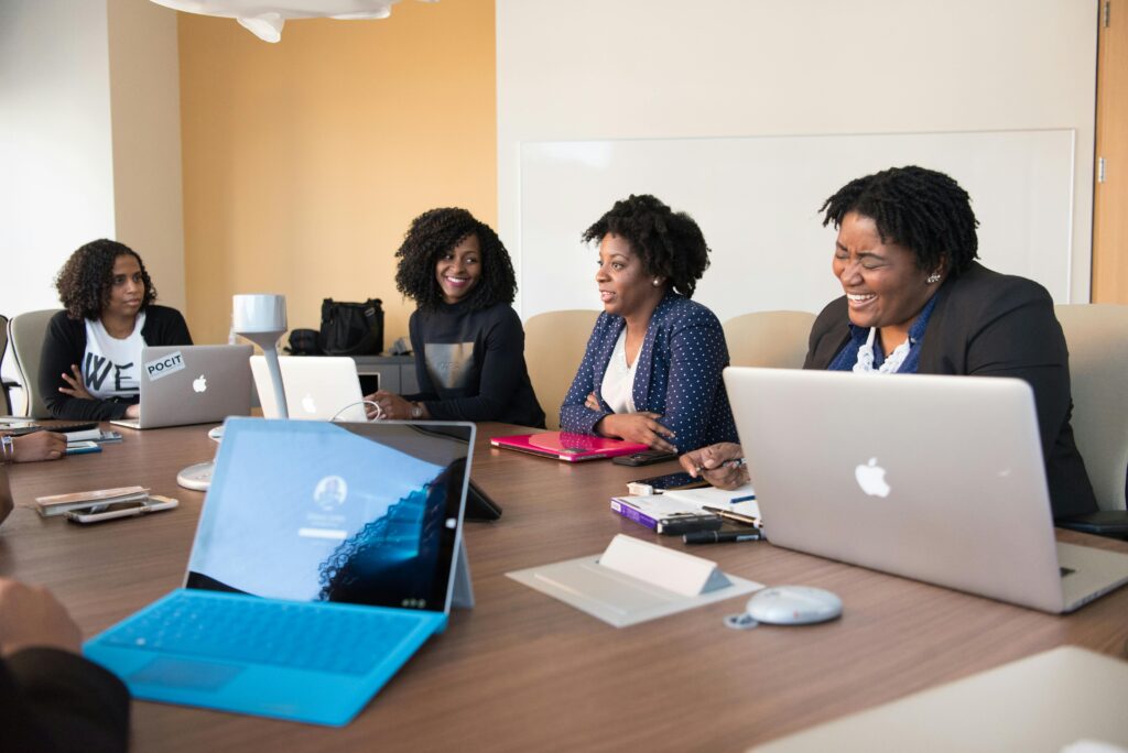 4 women meeting at conference table