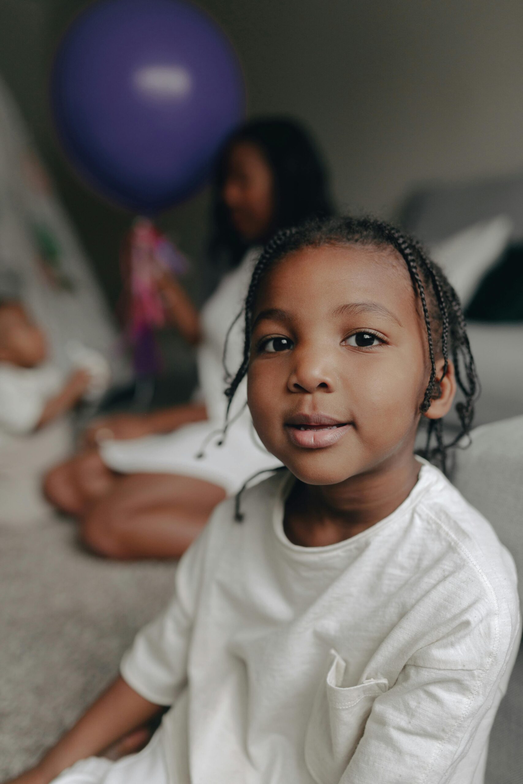Young black boy with braids